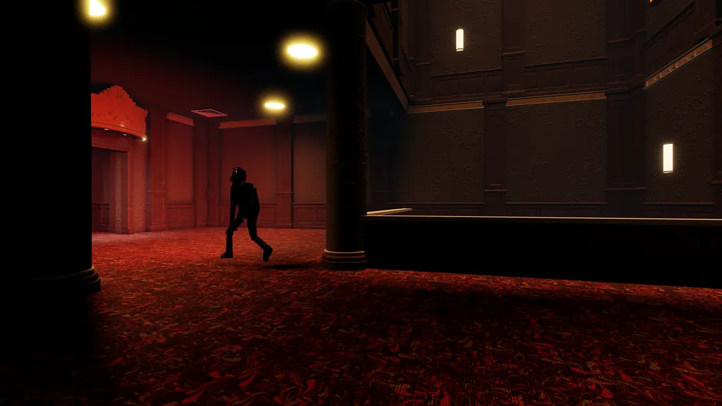 Official view inside The Hollow theater, showing a dark monster silhouette crossing a deep red carpet beneath warm ceiling lights.