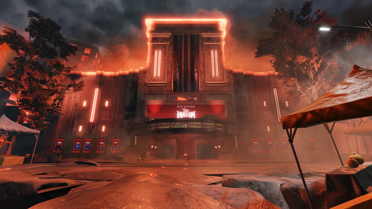 Official The Hollow theater exterior at night with a lit marquee and red fog for the Roblox event guide.